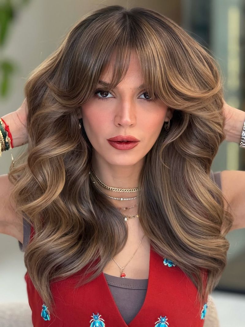 26. Voluminous 70s Layers with Curtain Bangs