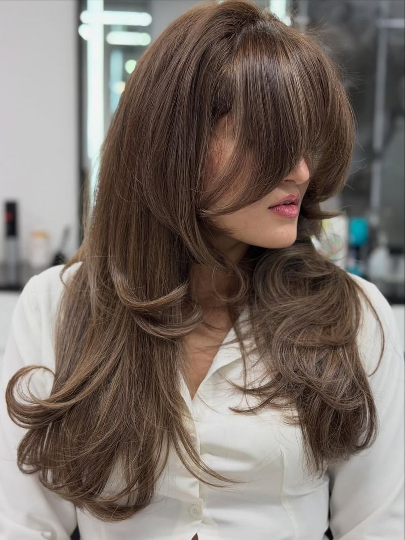 48. Voluminous Blowout with Heavy Bangs