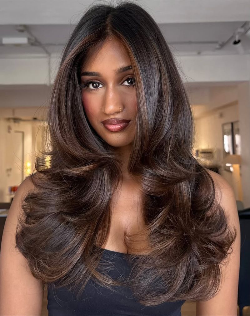 17. Voluminous Espresso Blowout with Curtain Bangs