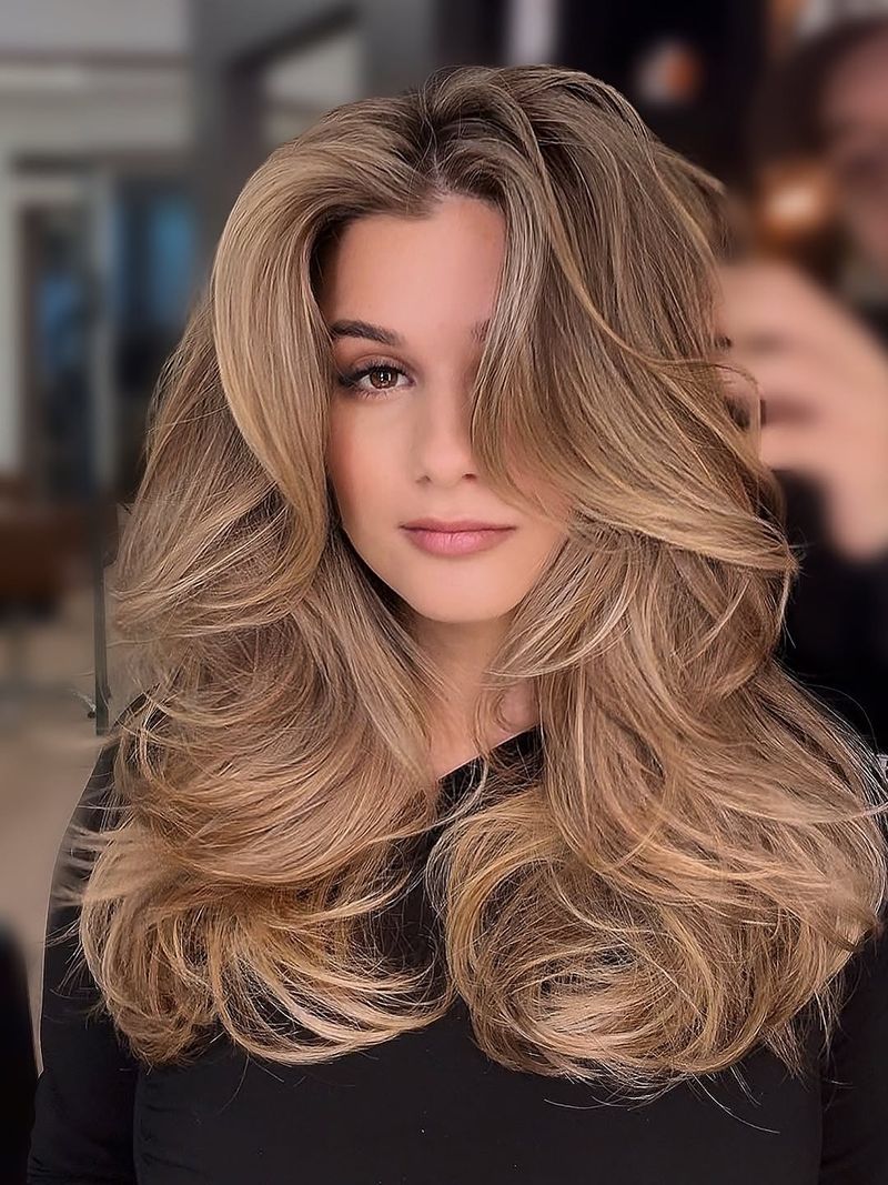 41. Voluminous Honey Blonde Butterfly Layers