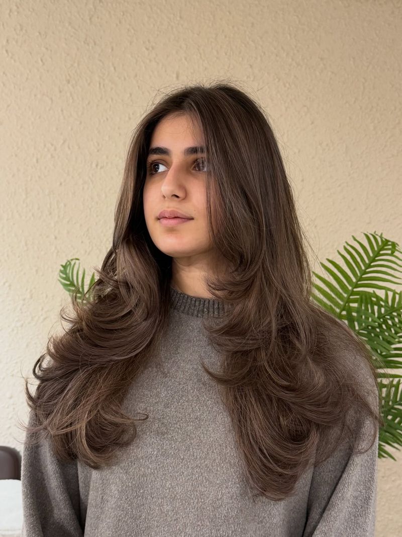 8. Voluminous Layered Cut with Ash Tones