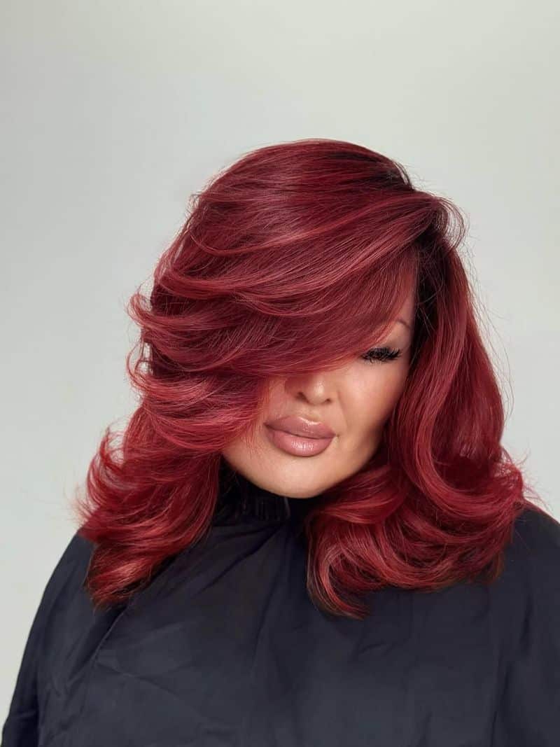 32. Voluminous Retro Layers with Deep Crimson Tones