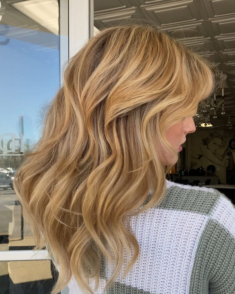 21. Warm Apricot Waves with Curtain Bangs