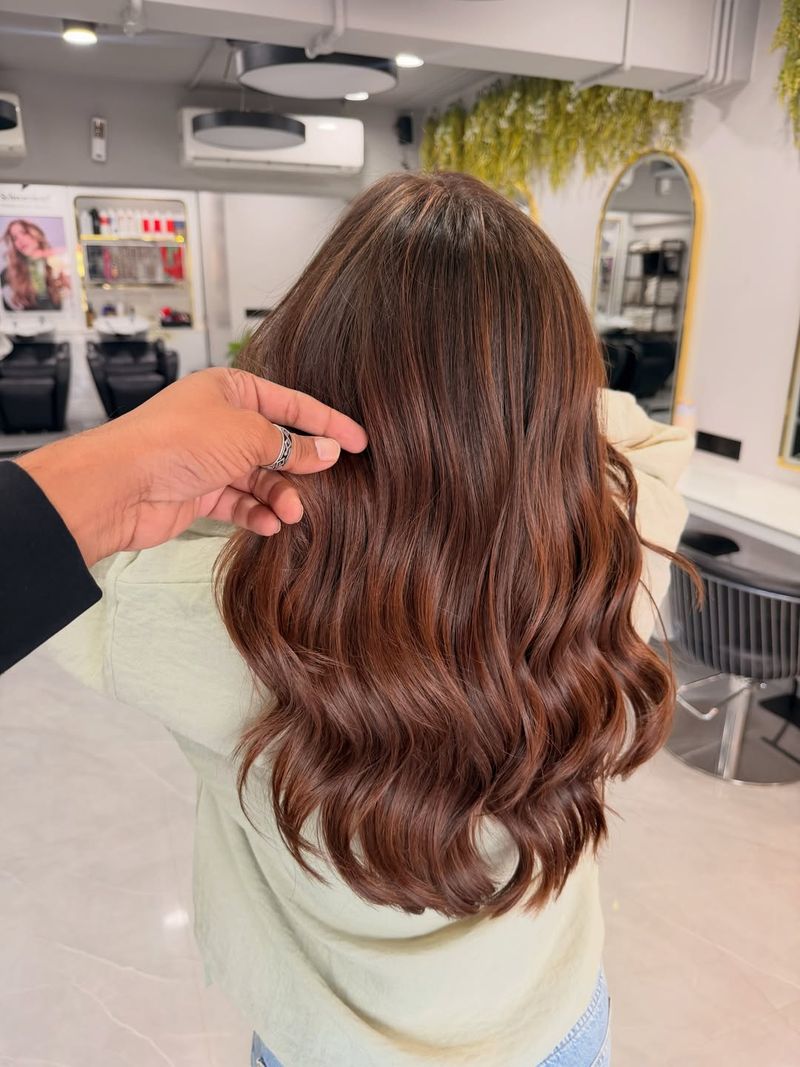 29. Warm Chestnut Waves with Caramel Balayage